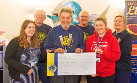 The cheque presentation to Phyllis Tuckwell Hospice by Lion President Chris Seabrook and Farnborough Lions members