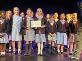 St Bernadette's Choir smiling proudly duringthe awards ceremony