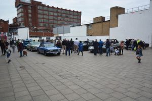 Crowds gather around the classic cars at the northern entrance to Queensmead